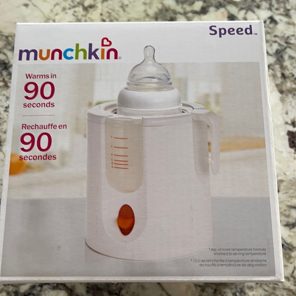 Munchkin bottle warmer. Still in box. Never used.